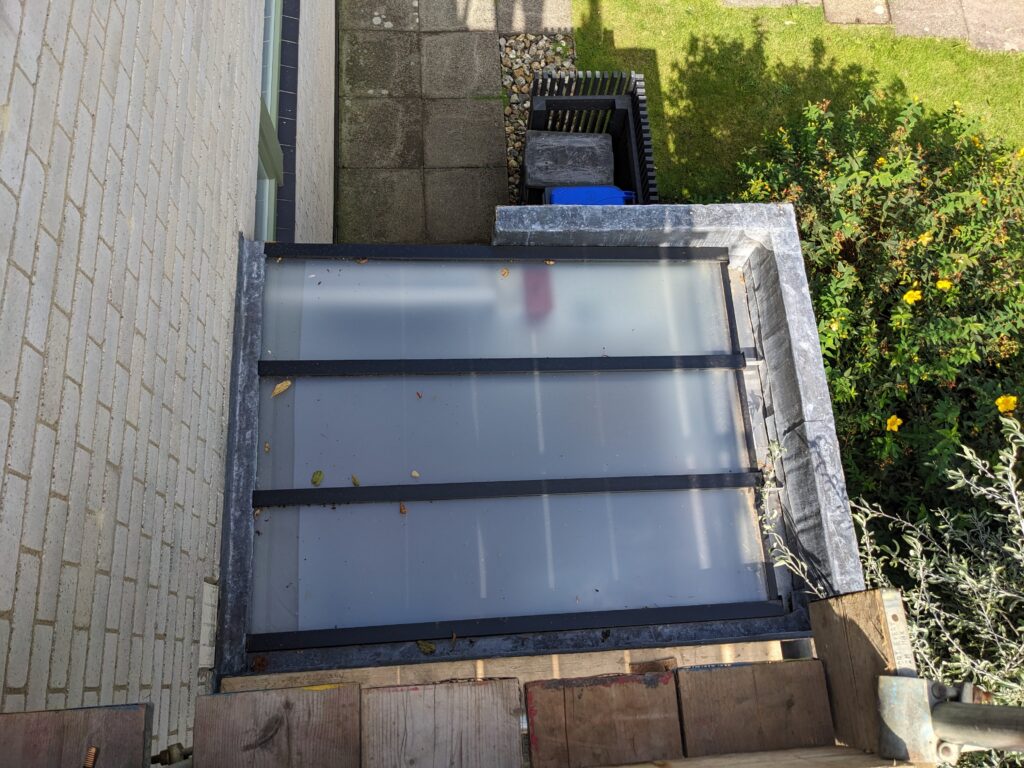 The new utility room roof from above. Note the obscured glass.